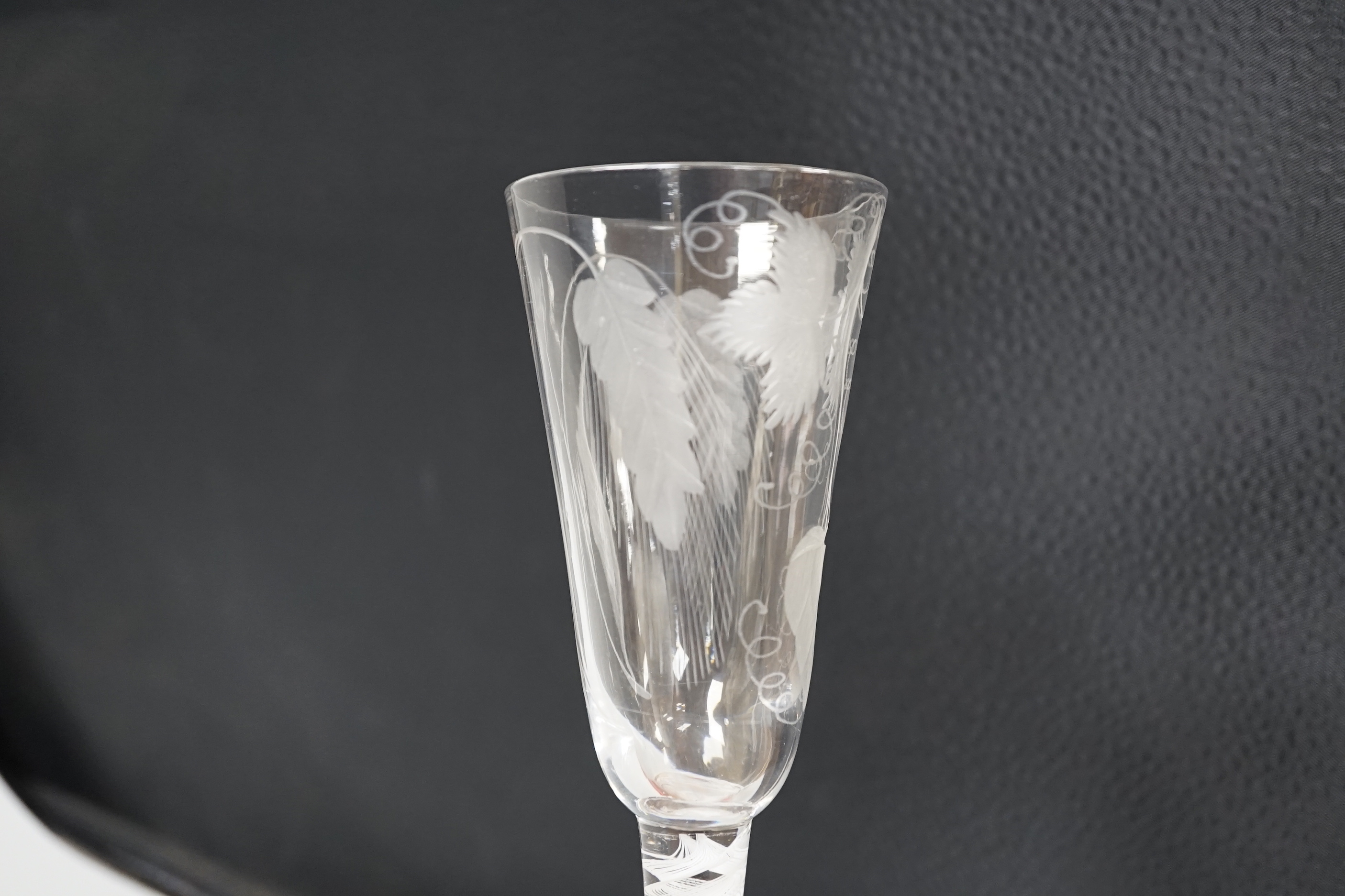 An English lead crystal SSOT ale glass, c.1760, the elongated round funnel bowl engraved with hops and barley, the stem with a rare SSOT scrambled eighteen ply spiral band, conical foot, snapped pontil, tool marked and s